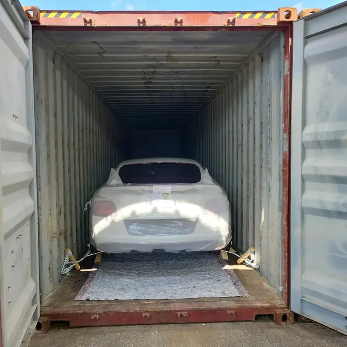 A vehicle secured inside a shipping container